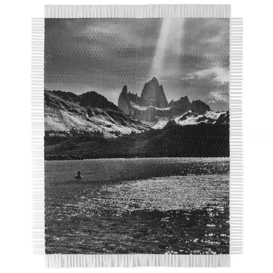 Black and white woven photograph of a mountain landscape