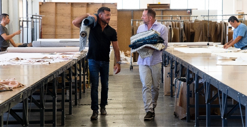 HW Home designers and makers reviewing upholstery in the True workshop